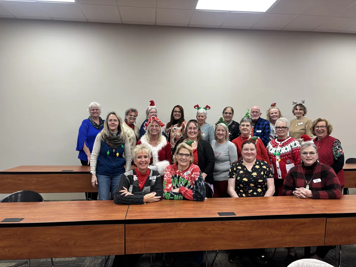 A chapter member in a Santa outfit at the 2025 Christmas party.