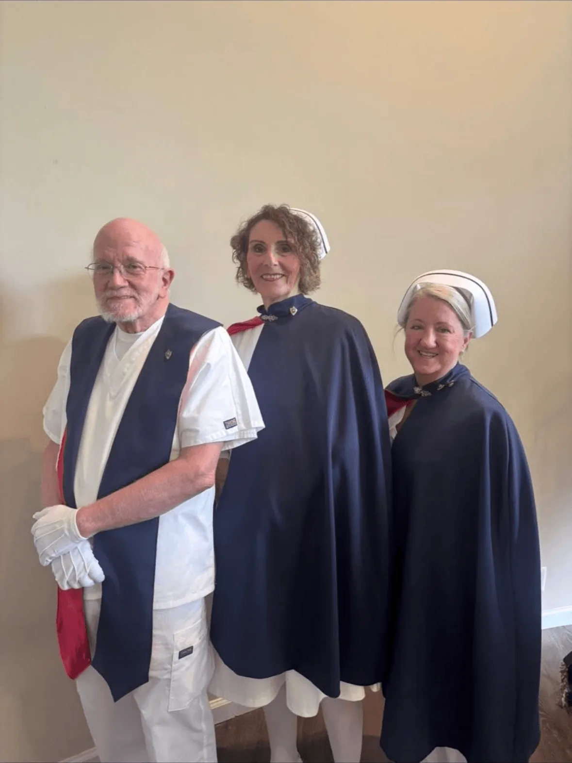 Bart McCuistion, Vicky Lowe and Beth Cruz in uniform and capes after being pinned for their first service with the East Tennessee Nurse Honor Guard.